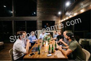 friends enjoying a private bachelor party inside a cabin at night